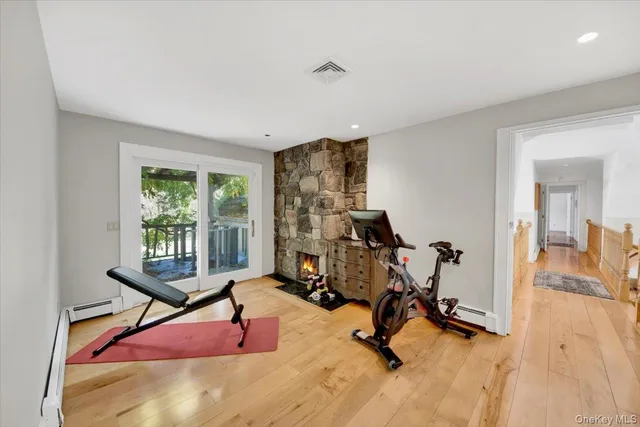 a spacious bedroom with a bed and a large window