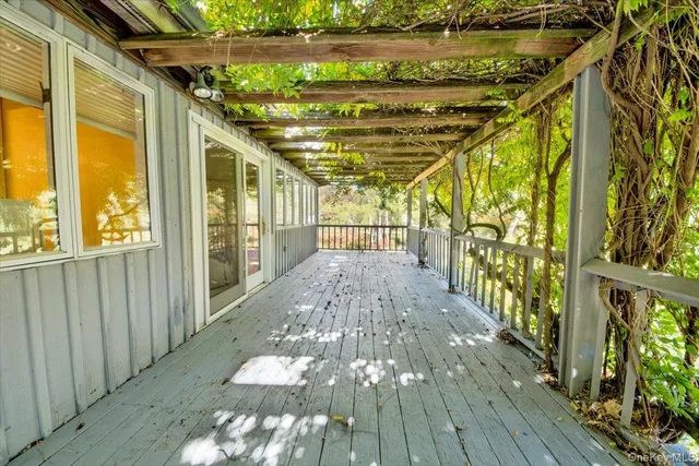 a bedroom with large bed and a large window