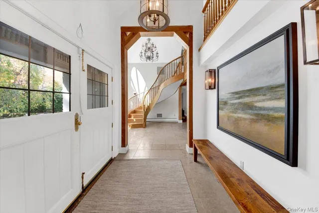 a view of a hallway with paintings on the walls