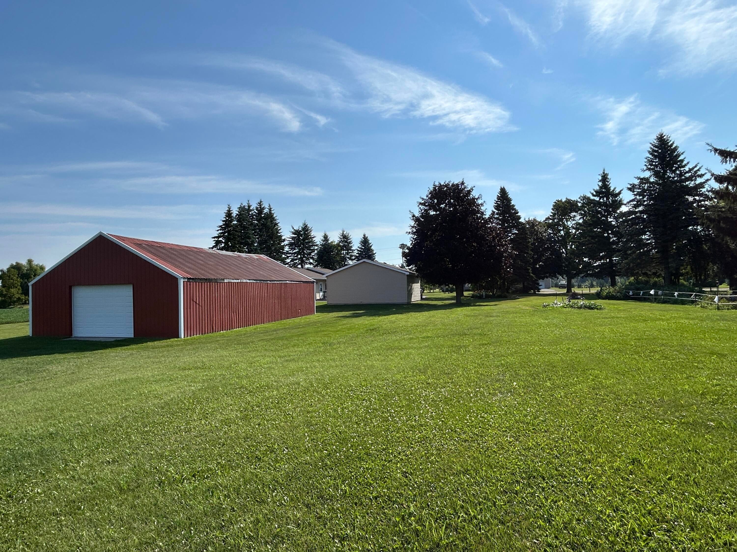 9634 Indian Reserve Road Alpena, MI 49707 - Photo 4 of 38 Pole building has a drive through door