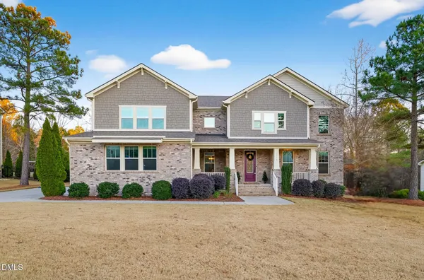 front view of a house with a yard