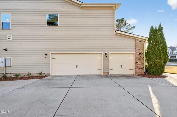 a kitchen with stainless steel appliances granite countertop a sink a stove and a wooden floors