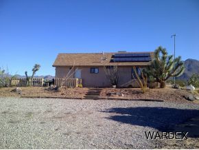 16550 Alamo Road Yucca, AZ 86438 - Photo 7 of 23 a view of a house with a dry yard