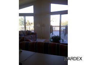 16550 Alamo Road Yucca, AZ 86438 - Photo 8 of 23 a living room with furniture and a large window