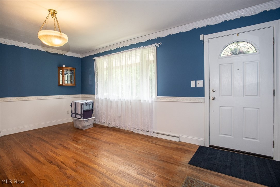 4962 Nettleton Road Medina, OH 44256 - Photo 4 of 43 Foyer featuring wood finished floors and ornamental molding