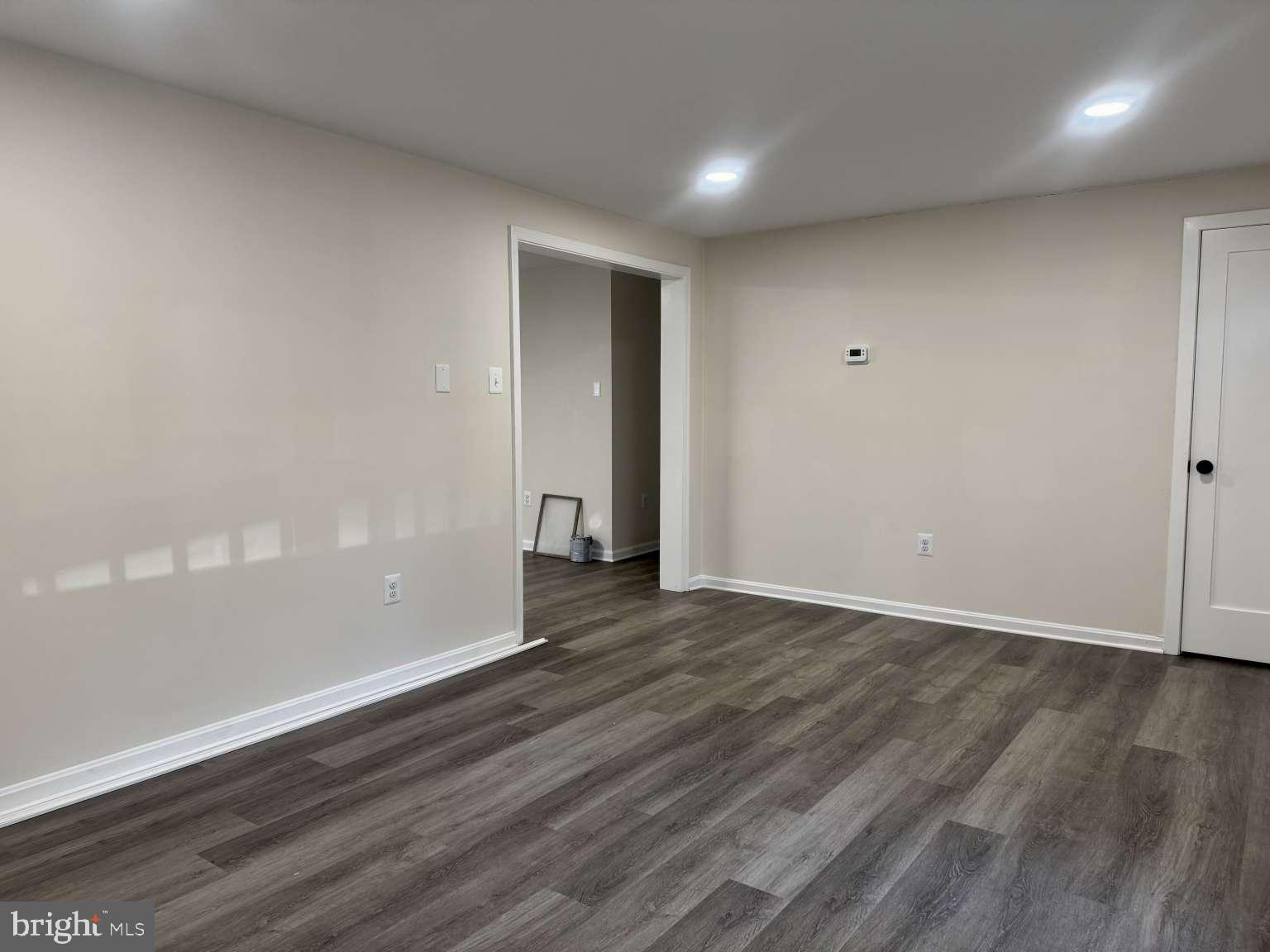905 Crystal Rock Road Lusby, MD 20657 - Photo 14 of 22 a view of an empty room with wooden floor