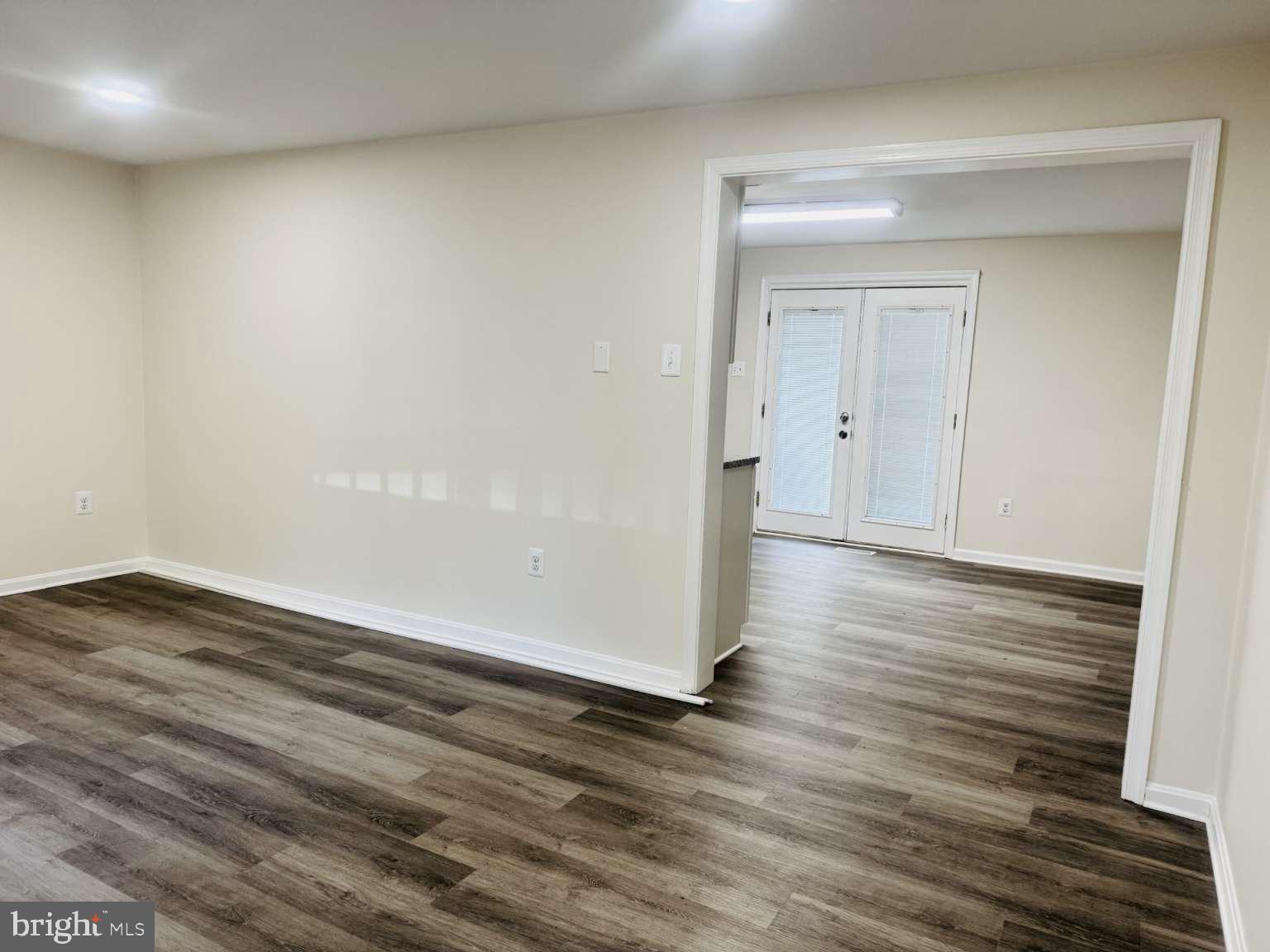 905 Crystal Rock Road Lusby, MD 20657 - Photo 4 of 22 a view of a room with wooden floor