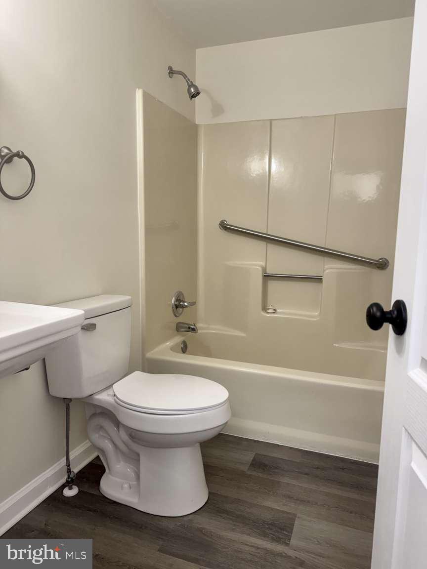 905 Crystal Rock Road Lusby, MD 20657 - Photo 6 of 22 a bathroom with a sink a toilet and shower