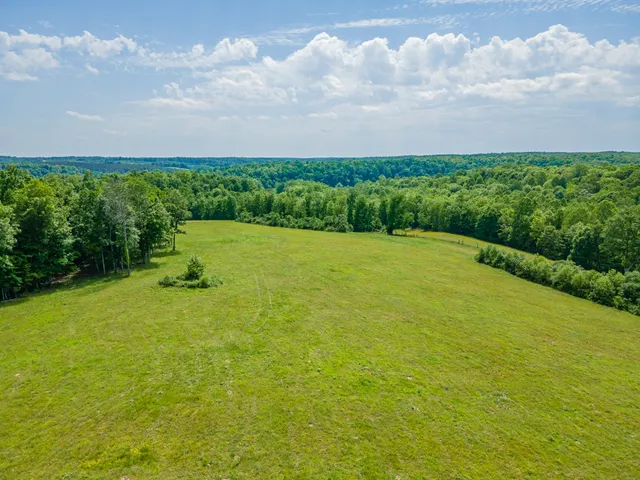 a view of a field with an outdoor space