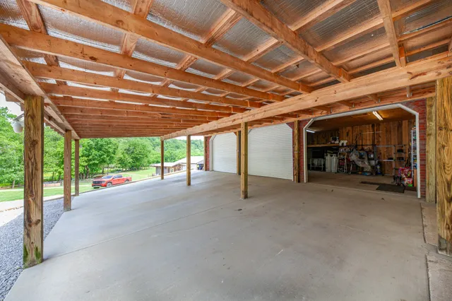 a view of a lush green outdoor space with a lake view