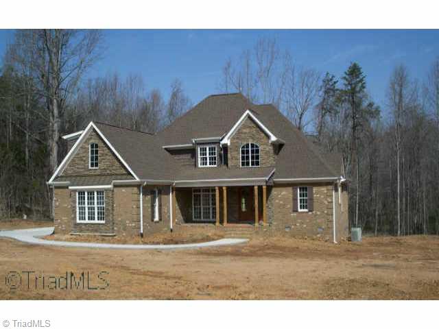 5809 Bison Drive Oak Ridge, NC 27310 - Photo 1 of 9 Exterior Front.