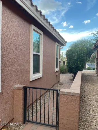 a view of a house with a chairs in patio