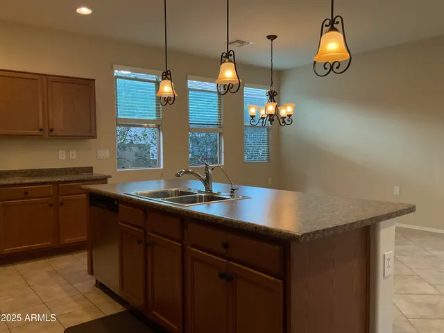 a kitchen with sink and window