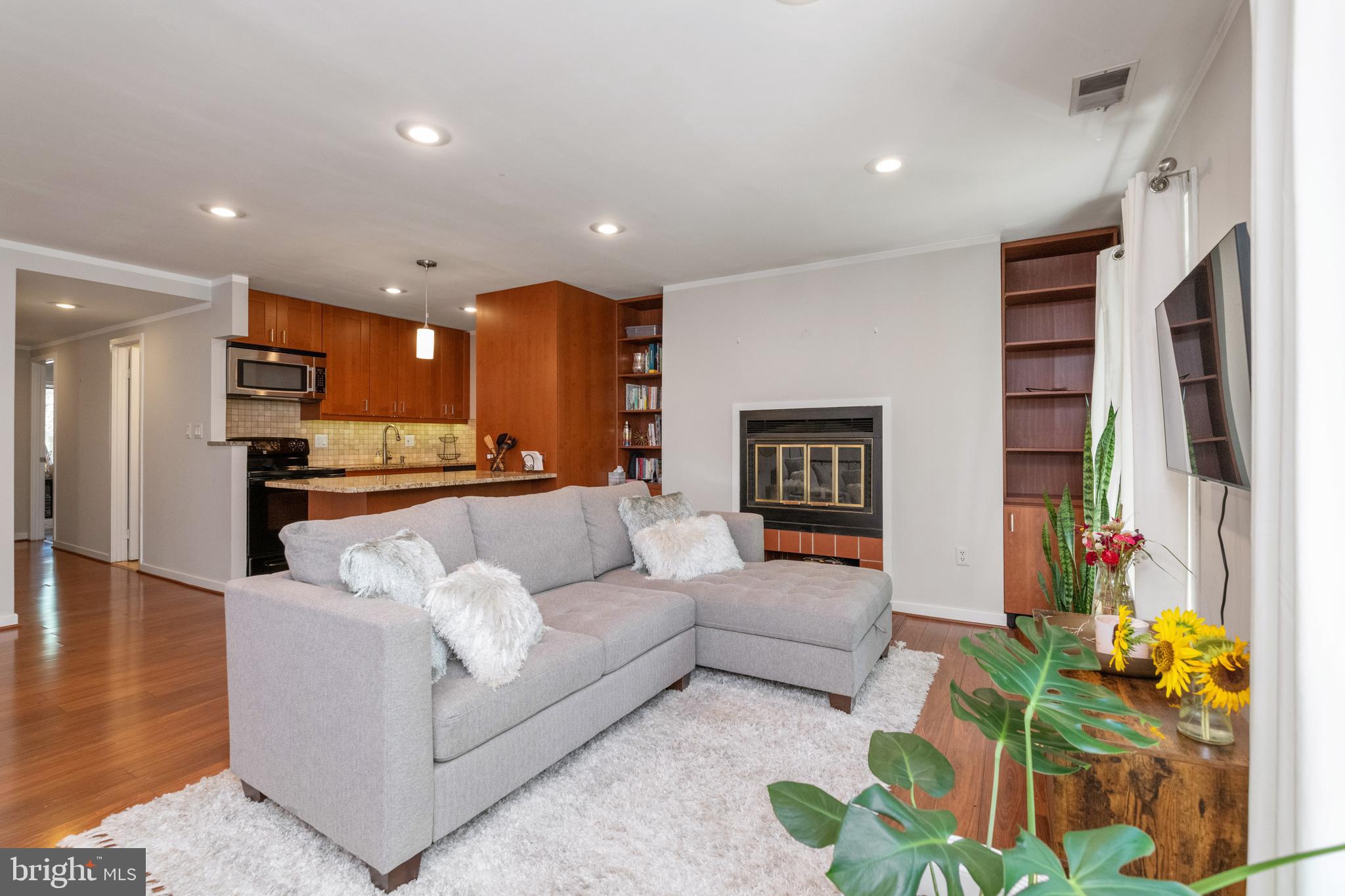162 West Barre Street, Unit R21 Baltimore, MD 21201 - Photo 5 of 29 Built-ins surrounding wood burning fireplace
