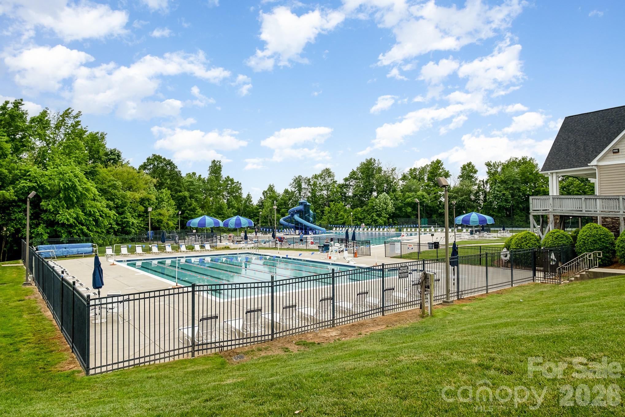 a view of a swimming pool with a patio