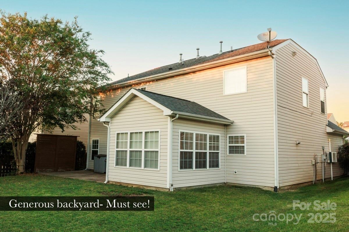 1457 Prestbury Road Northwest Concord, NC 28027 - Photo 15 of 19 a view of a house with a yard