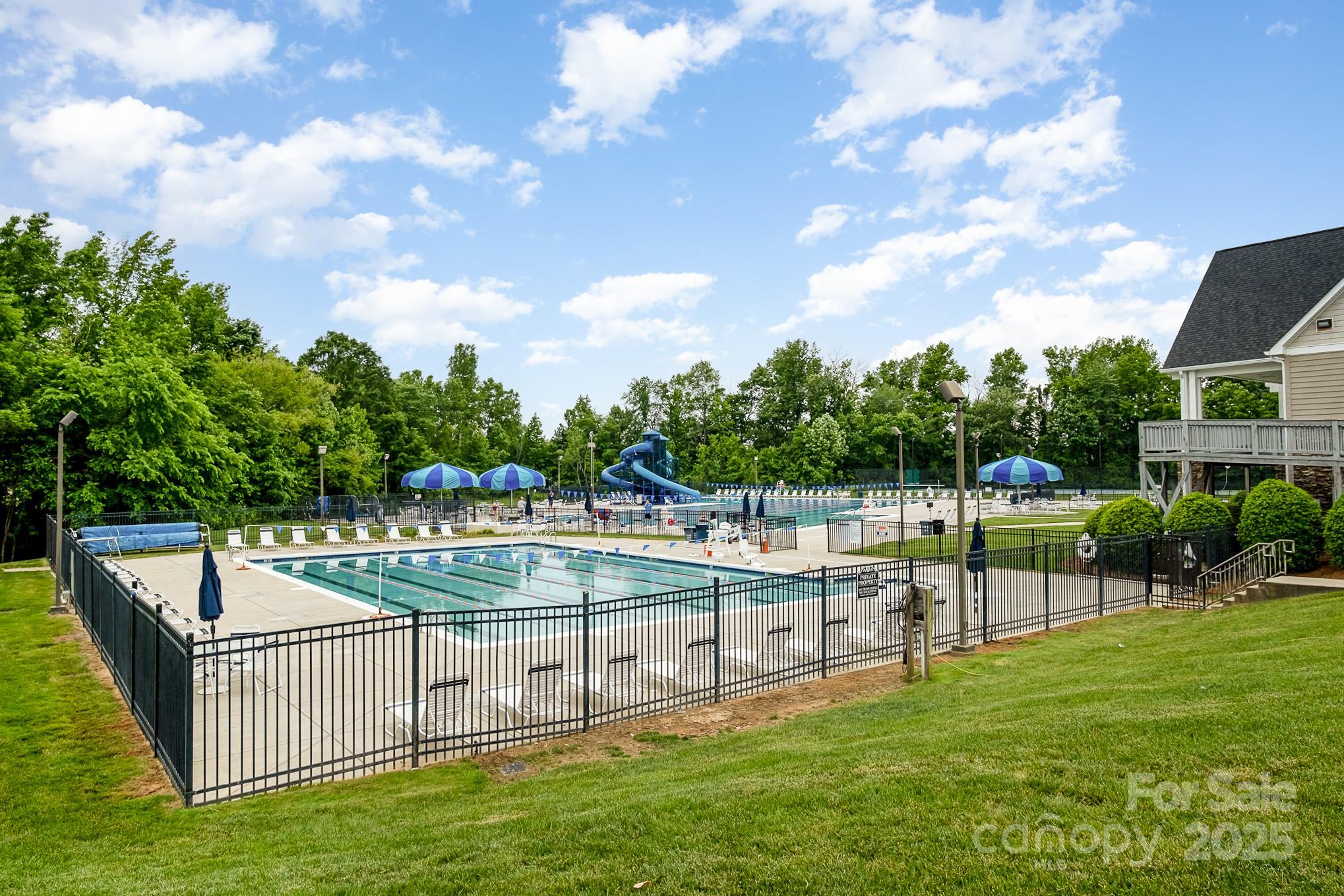 1457 Prestbury Road Northwest Concord, NC 28027 - Photo 3 of 19 a view of a swimming pool with a patio