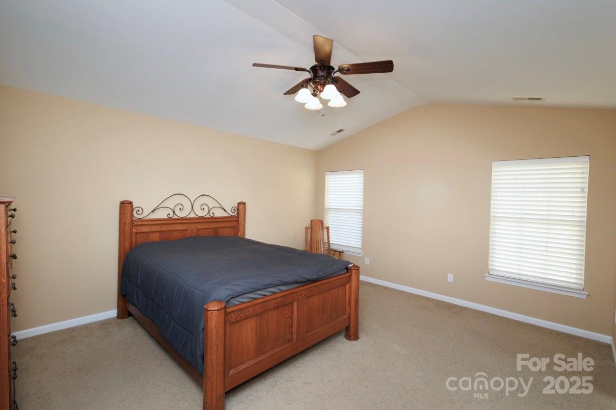1457 Prestbury Road Northwest Concord, NC 28027 - Photo 7 of 19 a room with a bed and window