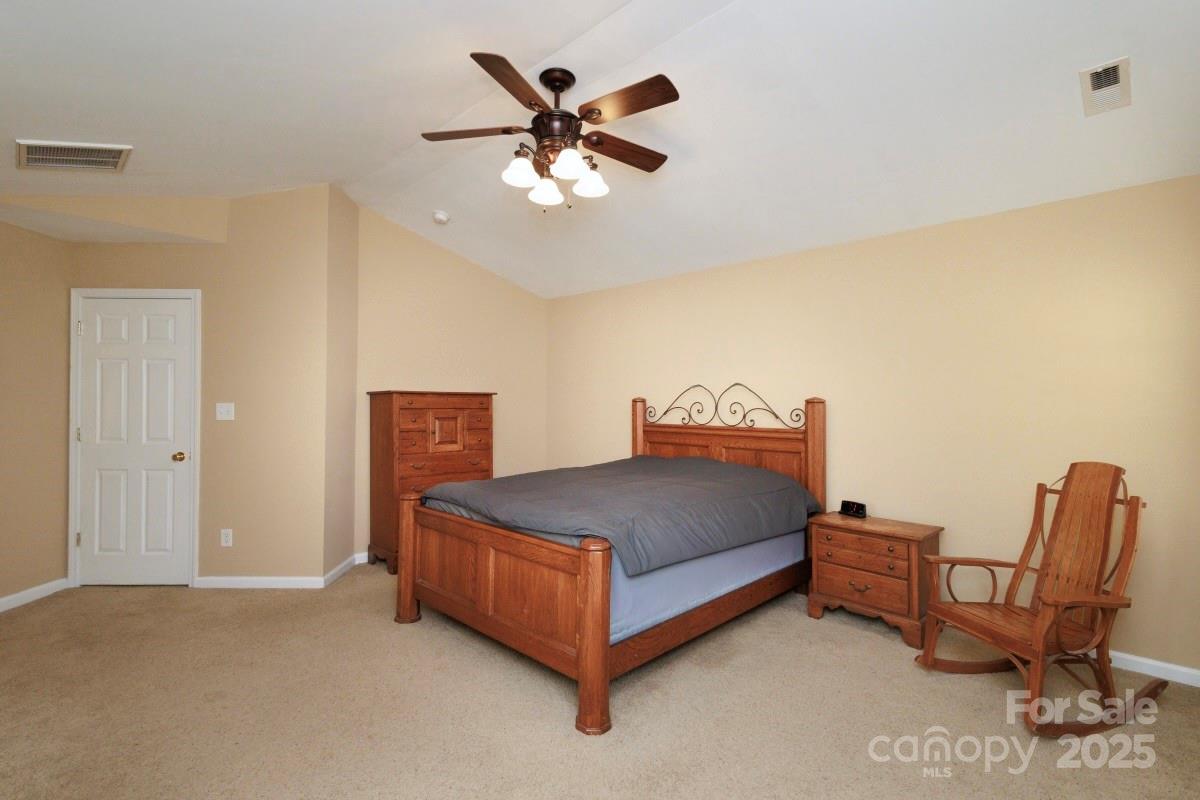 1457 Prestbury Road Northwest Concord, NC 28027 - Photo 8 of 19 a bed room with a bed and a chair