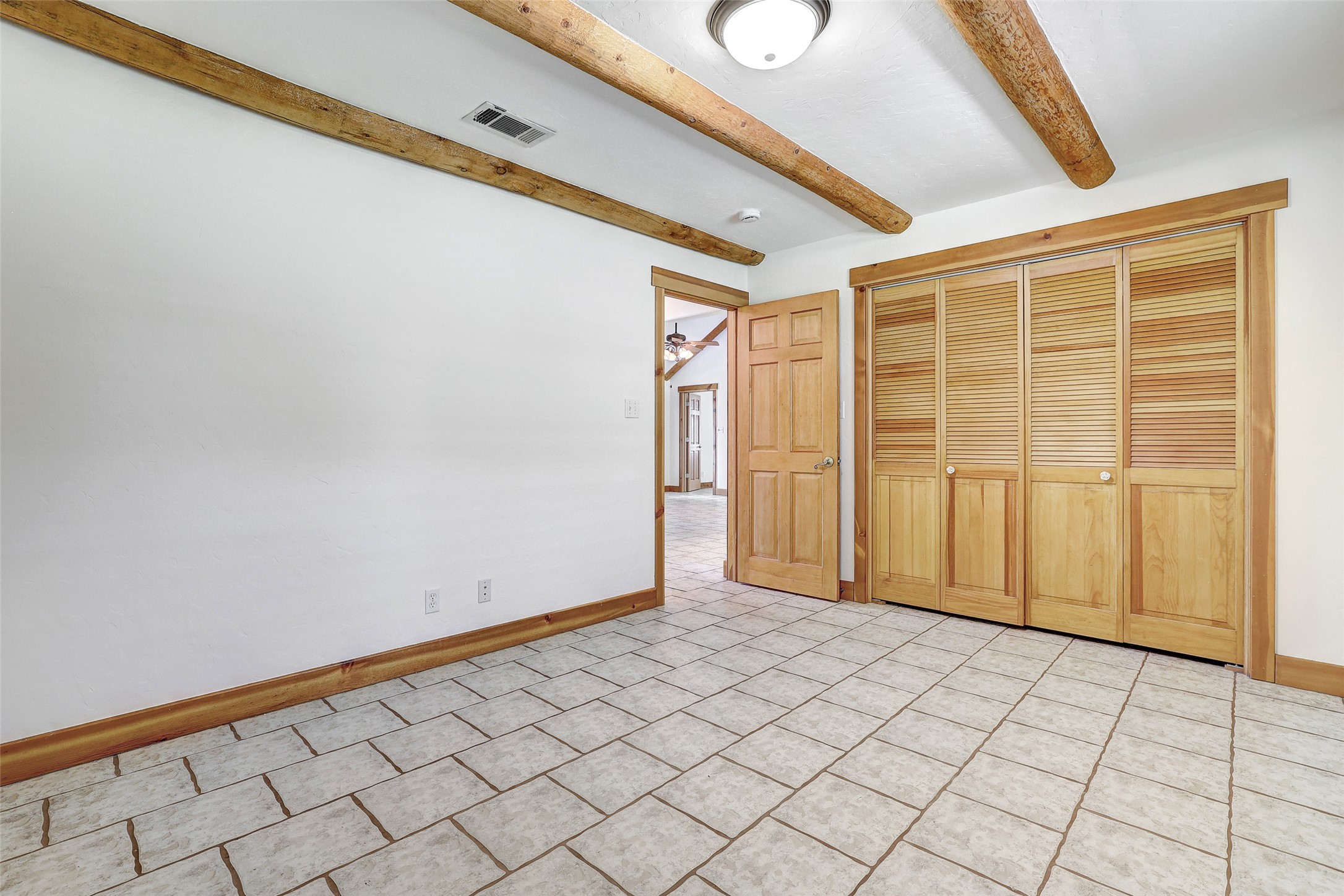 125 Kyle Lane Georgetown, TX 78633 - Photo 23 of 34 Unfurnished bedroom with a closet and beamed ceiling