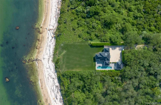 a view of a garden with a building in the background