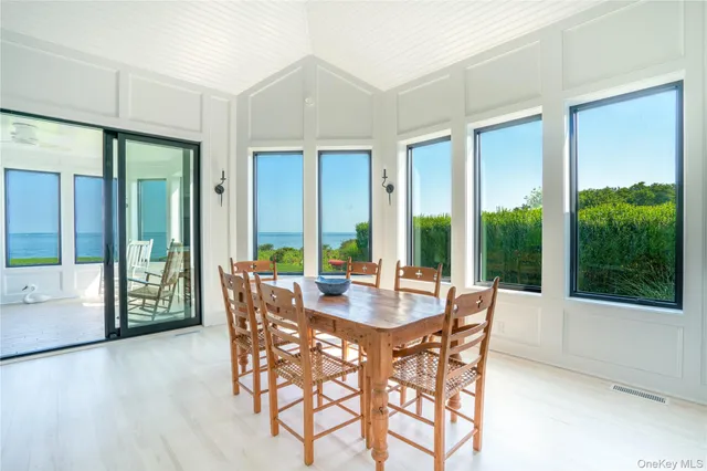 a living room with furniture a fireplace and a table