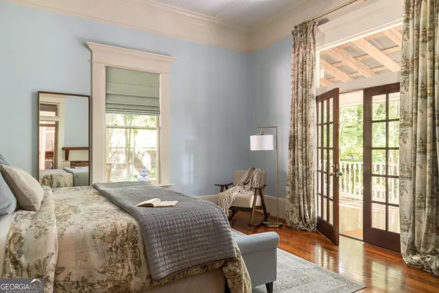 a bedroom with a bed and a fireplace