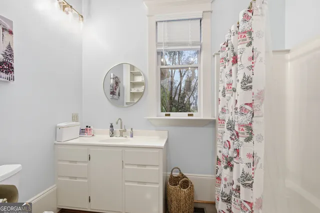a view of hallway with wooden floor