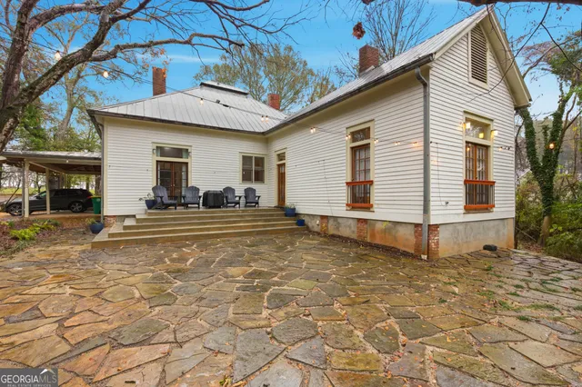 a view of a forest with trees in the background