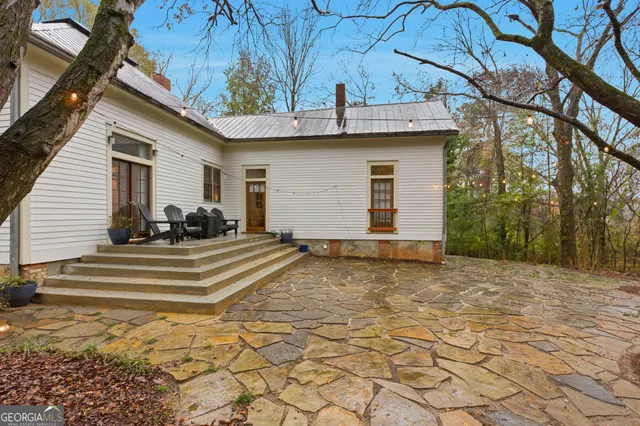 a view of a room with wooden walls and iron stairs