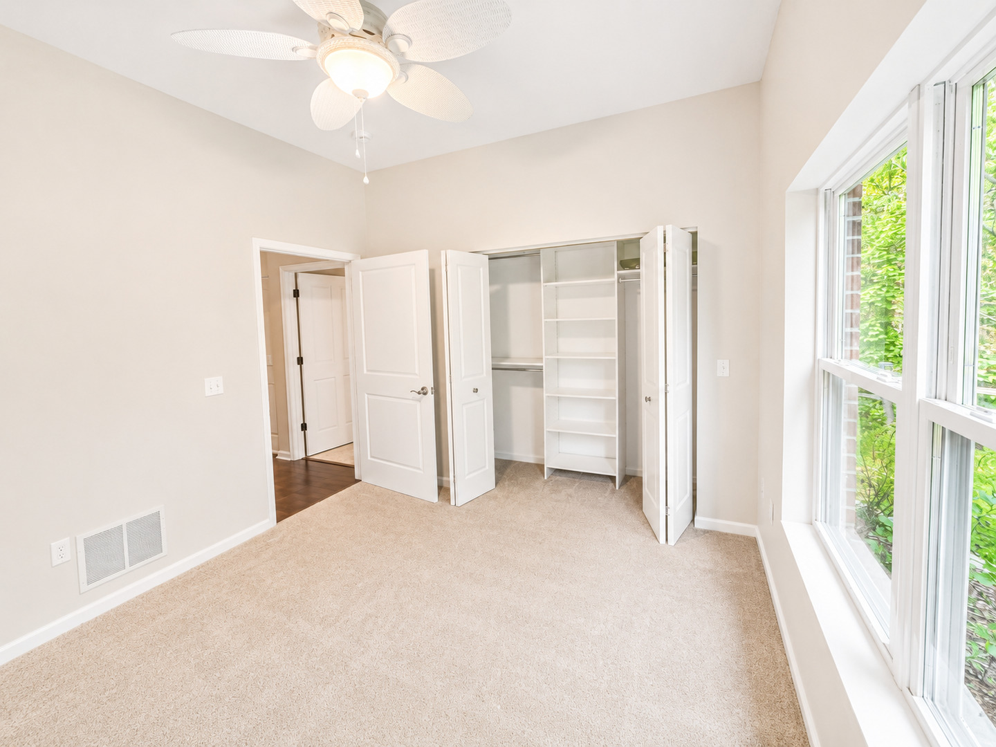 1002 2nd St Court Moline, IL 61265 - Photo 22 of 31 a view of empty room with cabinet and ceiling fan