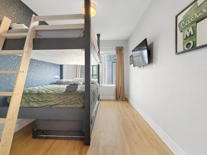 a bathroom with a shower a sink and mirror