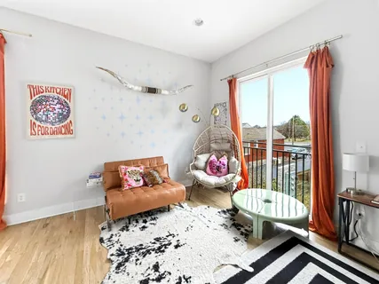 a view of a living room with a wooden floor