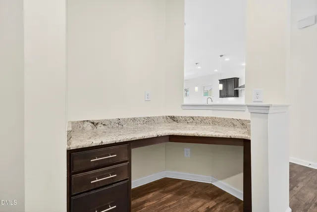 a utility room with a fireplace and vanity