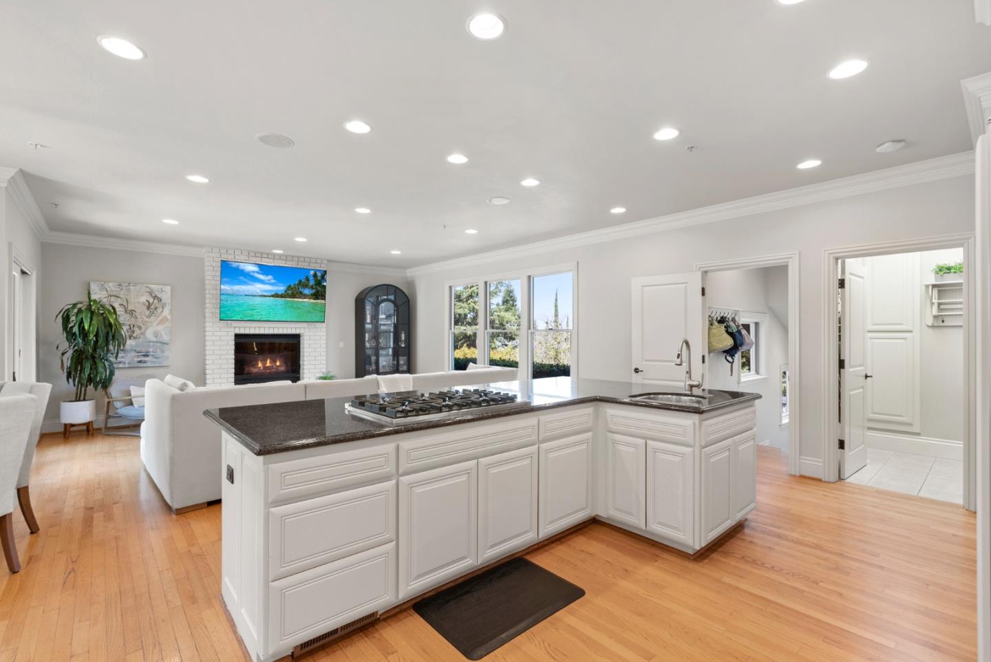 125 Dover Street Los Gatos, CA 95032 - Photo 16 of 49 a kitchen with sink stove and white cabinets with wooden floor