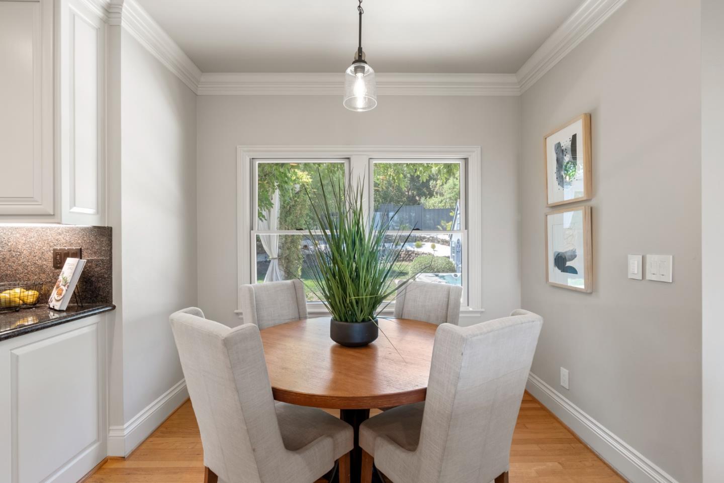 125 Dover Street Los Gatos, CA 95032 - Photo 18 of 49 a dining room with furniture potted plants and wooden floor