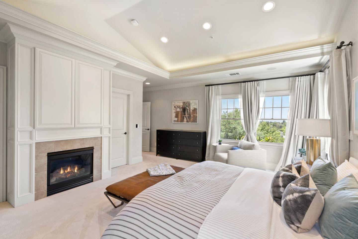 125 Dover Street Los Gatos, CA 95032 - Photo 21 of 49 a bedroom with a large bed and a fireplace
