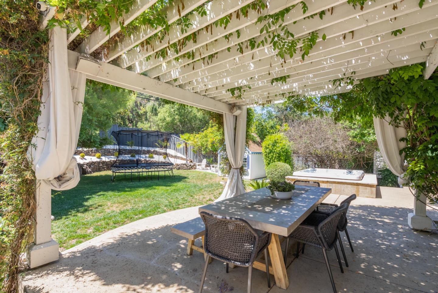 125 Dover Street Los Gatos, CA 95032 - Photo 38 of 49 a view of a patio with a table chairs and a backyard