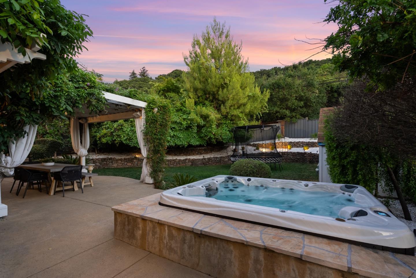 125 Dover Street Los Gatos, CA 95032 - Photo 4 of 49 a view of a back yard with a bench