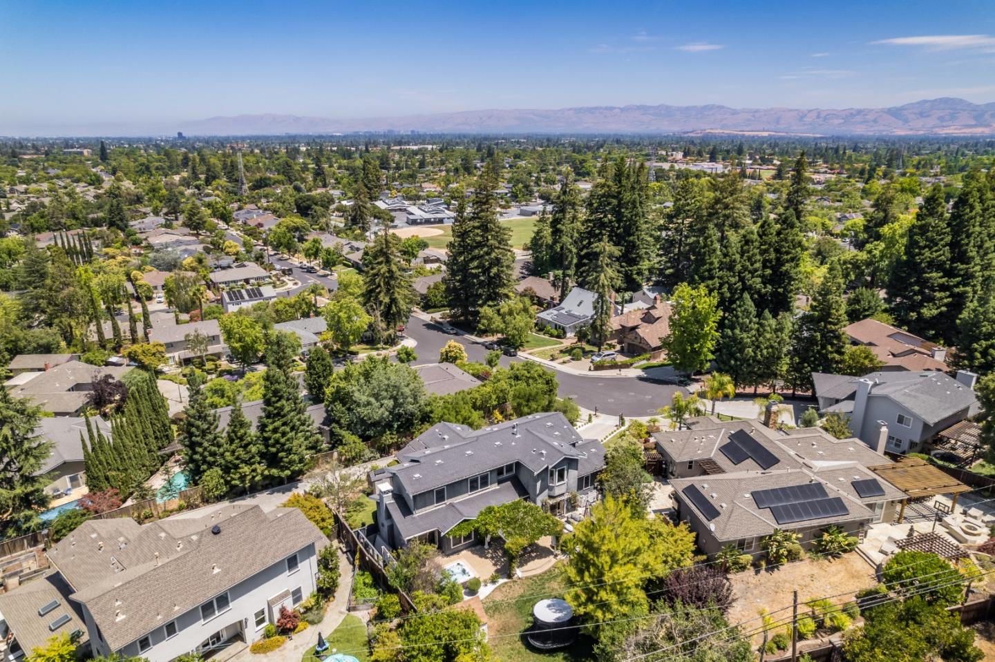 125 Dover Street Los Gatos, CA 95032 - Photo 45 of 49 an aerial view of a city with lots of residential buildings ocean and mountain view in back
