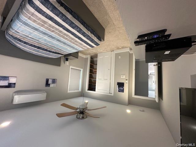 884 Beach Street Lindenhurst, NY 11757 - Photo 5 of 9 a bedroom with a bed a ceiling fan and a dresser