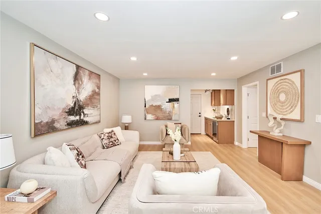 a living room with furniture and a large window