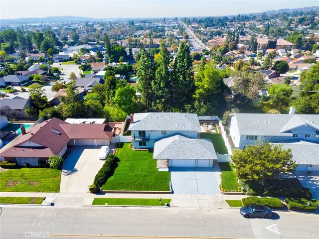 an aerial view of a house with a garden and plants