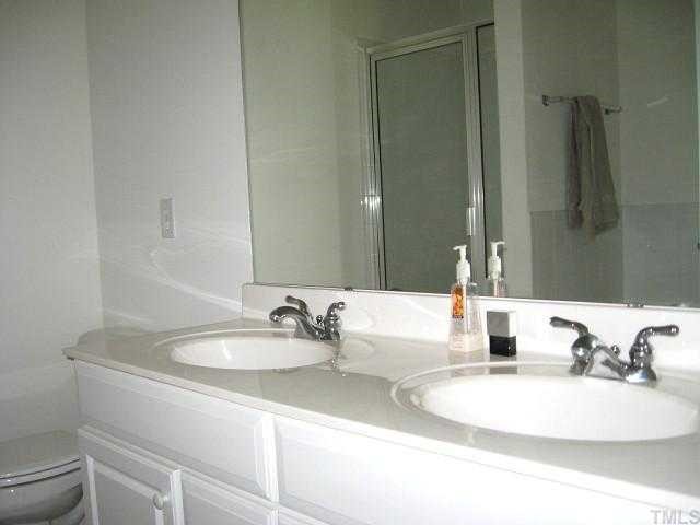 Private master bath with dual vanity areas, garden tub, separate shower, & tile floor