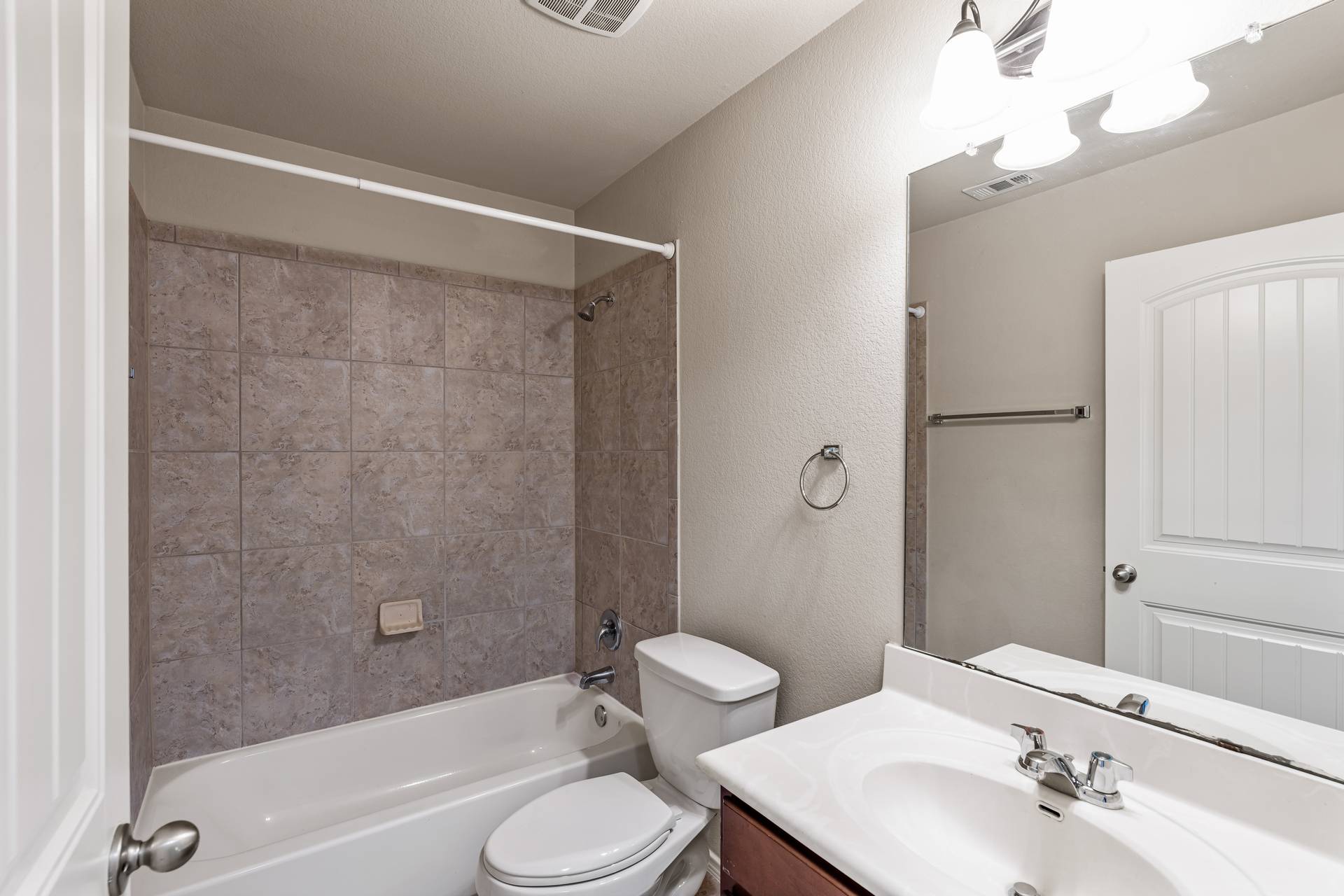 180 Fletcher Bend Buda, TX 78610 - Photo 23 of 36 a bathroom with a sink toilet and shower