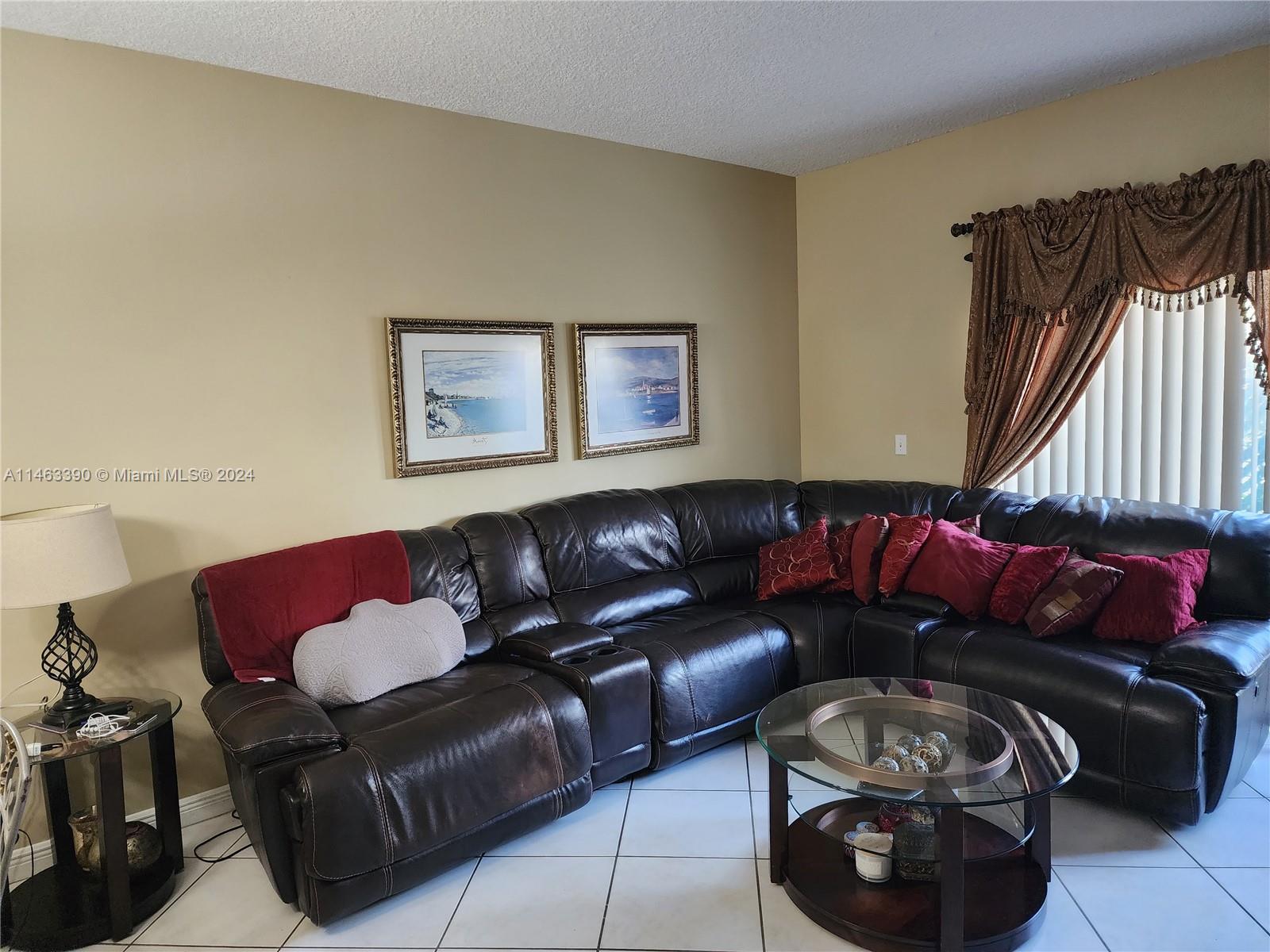 8260 Northwest 10th Street, Unit 2 Miami, FL 33126 - Photo 2 of 9 a living room with furniture and a couch