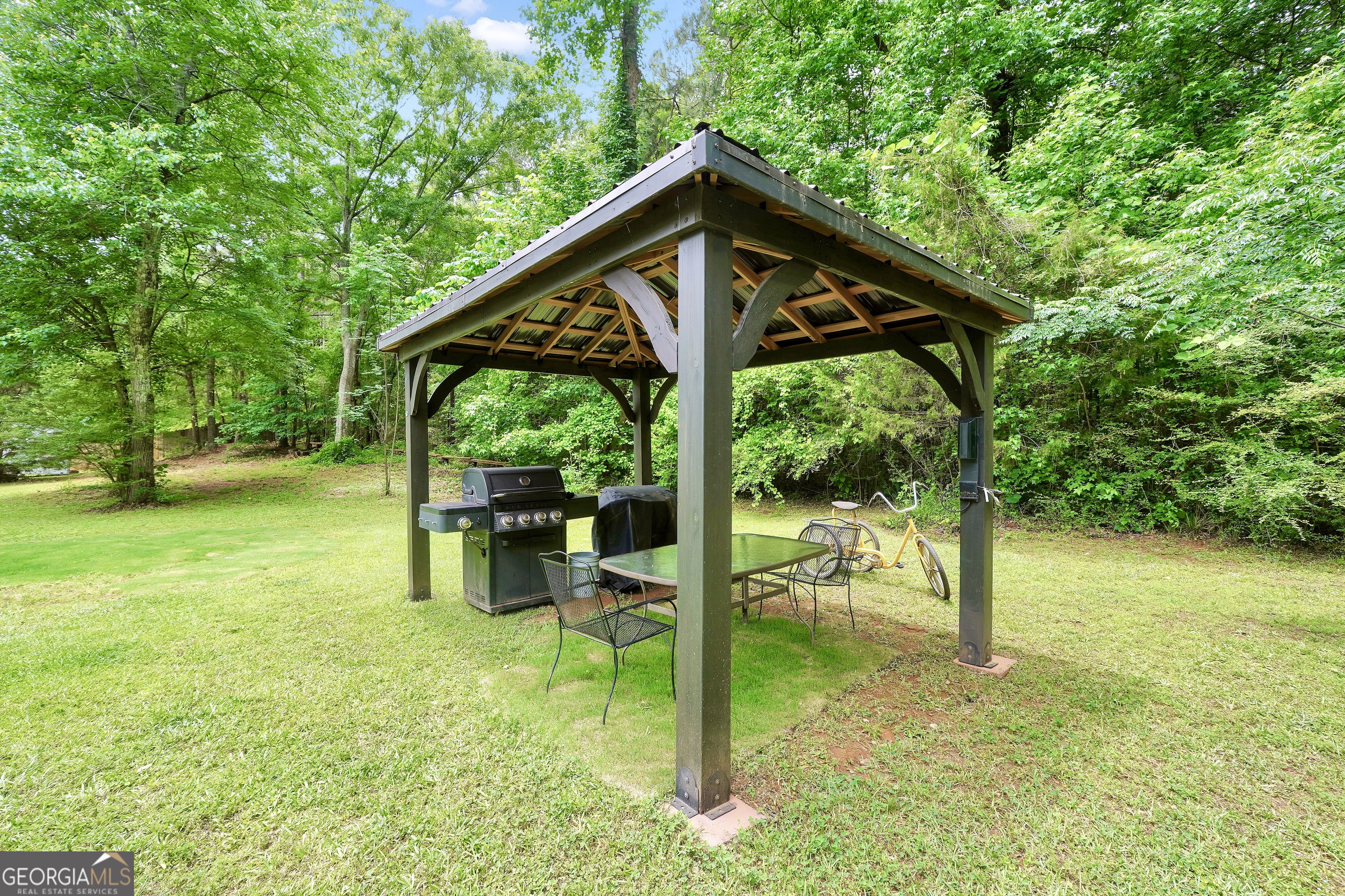 110 Westeria Way Jackson, GA 30233 - Photo 38 of 45 a view of a wooden deck and a backyard