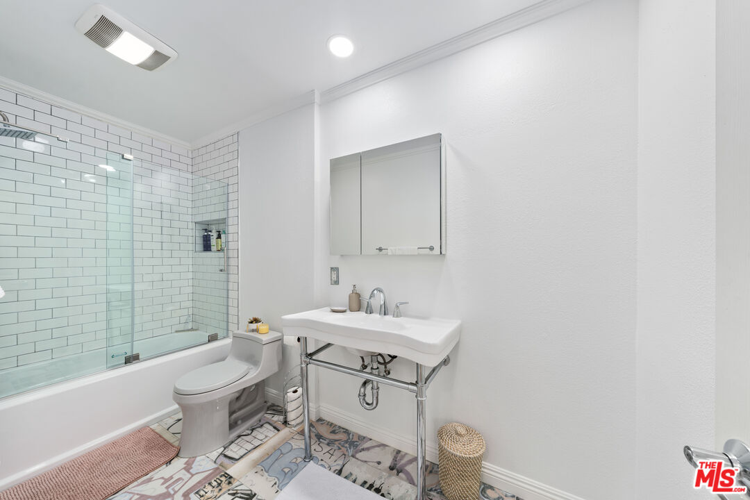 750 North Kings Road, Unit 204 Los Angeles, CA 90069 - Photo 18 of 23 a bathroom with a sink toilet and shower