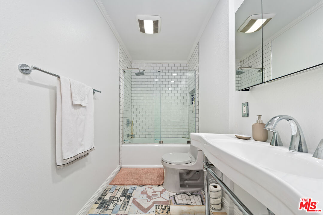750 North Kings Road, Unit 204 Los Angeles, CA 90069 - Photo 19 of 23 a bathroom with a sink a toilet and shower