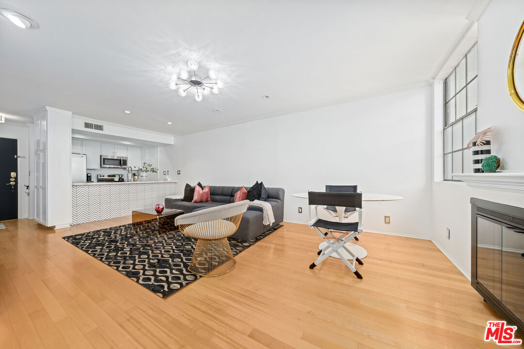 750 North Kings Road, Unit 204 Los Angeles, CA 90069 - Photo 10 of 23 a bedroom with furniture and a couch